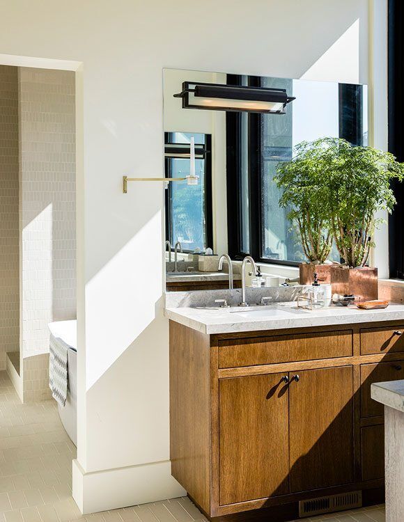 Master installer hand-setting natural stone using traditional mortar-bed craft at Miconi Marble & Tile
