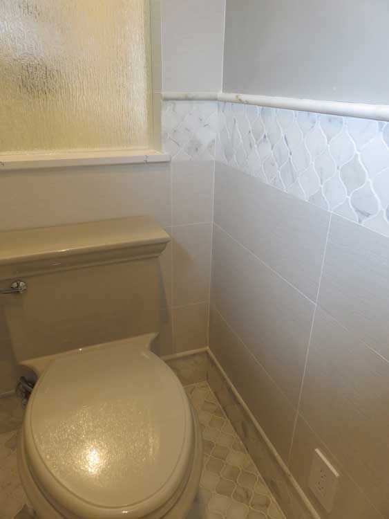 Marin County bathroom by Miconi Marble & Tile — frameless glass shower with stone (project 39)