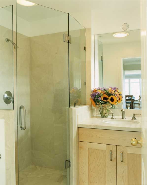 Natural stone tile bathroom floor and walls by Miconi Marble & Tile