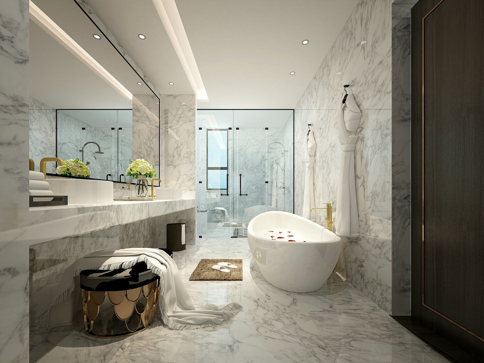 Luxurious bathroom with white marble surfaces, freestanding tub, and modern fixtures