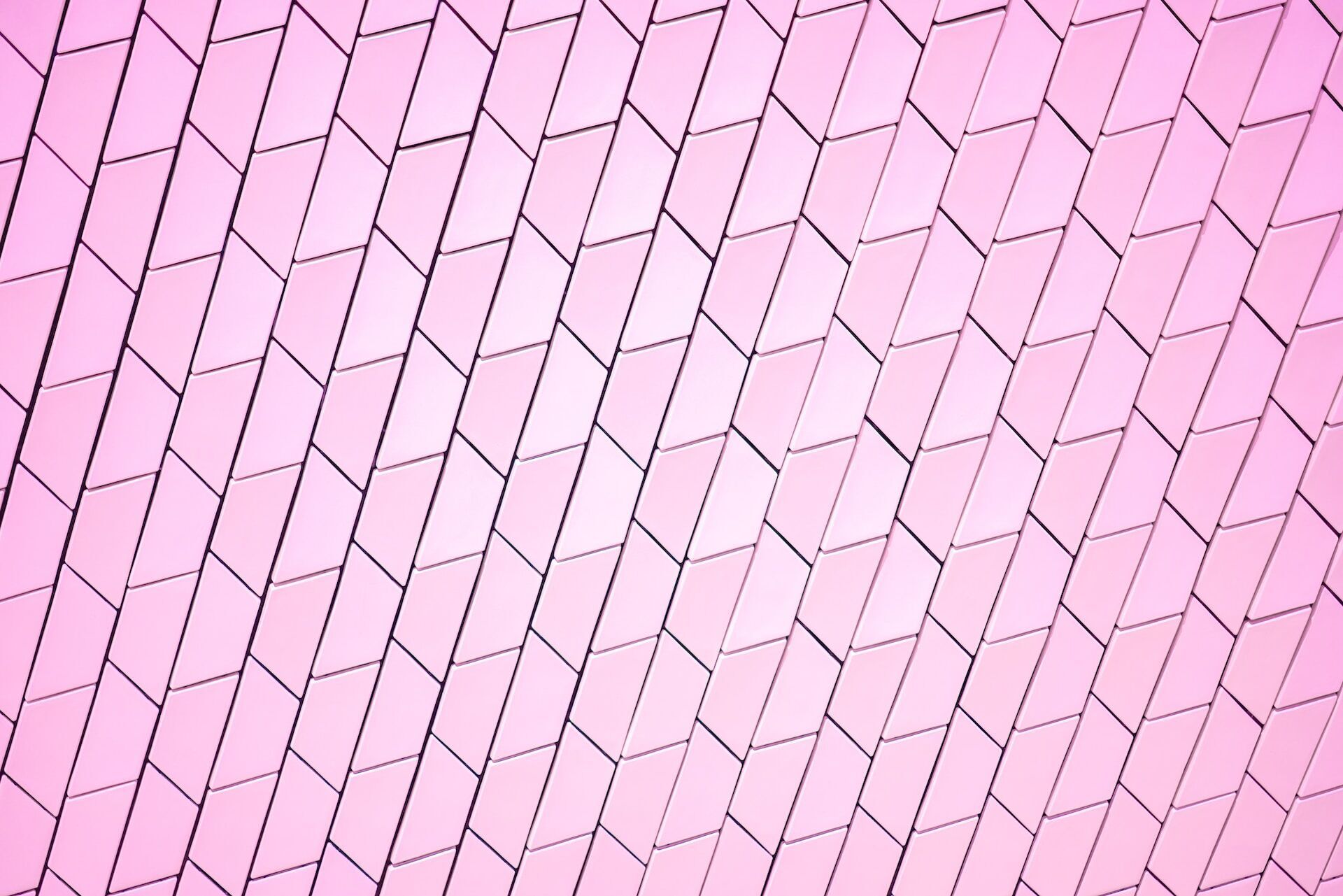 Pink tiles arranged in a diagonal geometric pattern, creating a modern look