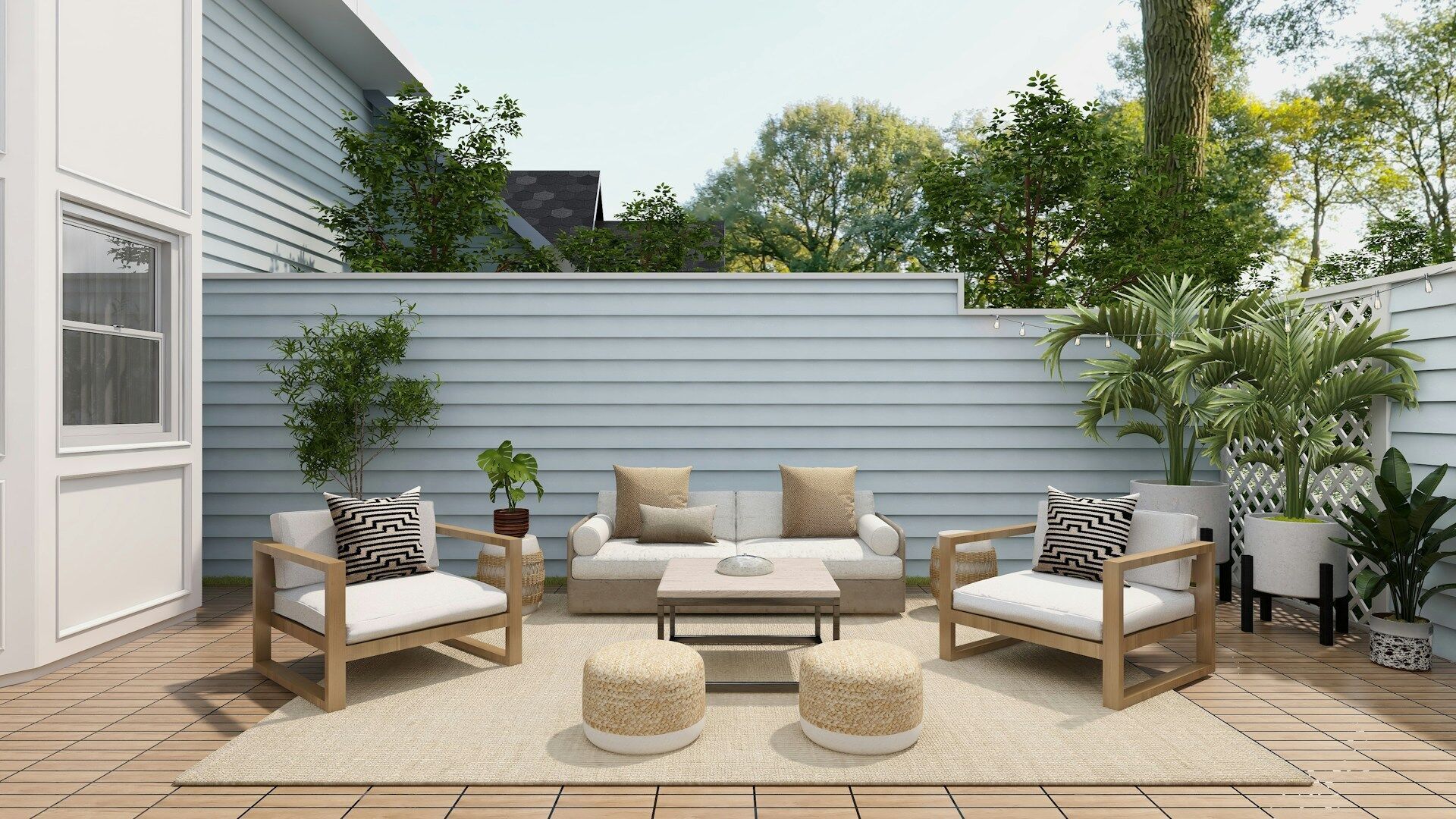 Outdoor patio with wooden furniture, potted plants, and a wooden deck surrounded by a white fence