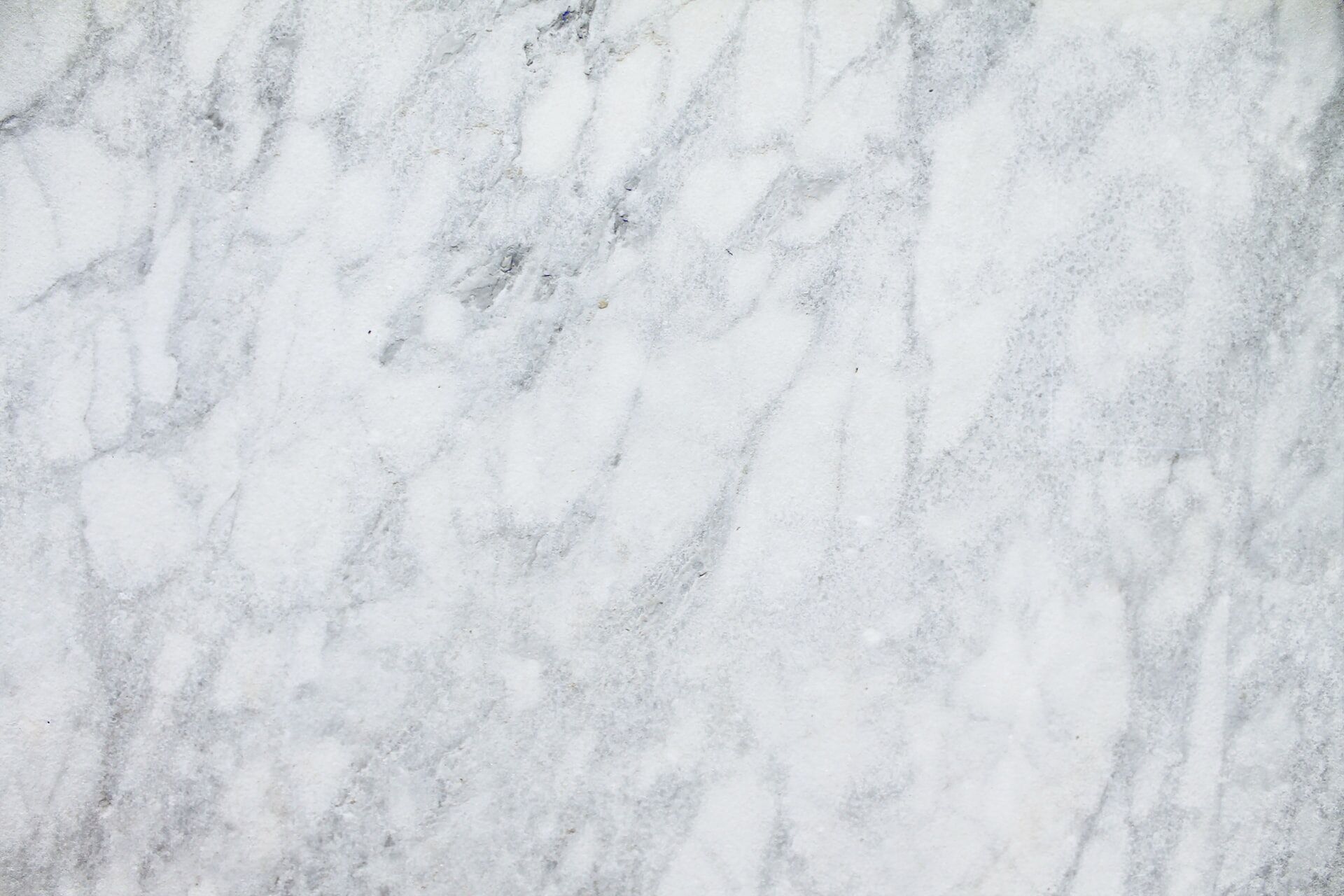 Close-up of white marble with gray veining, showcasing natural stone texture