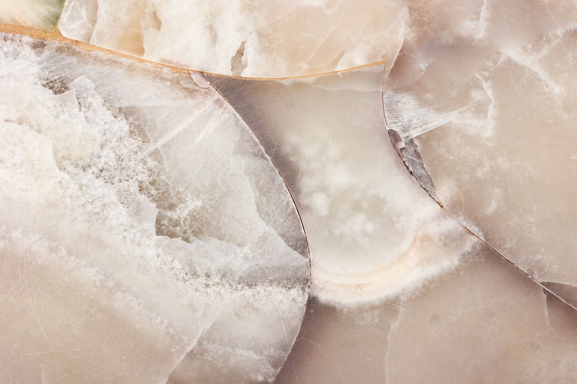 Close-up of a polished marble surface showing intricate patterns and veining