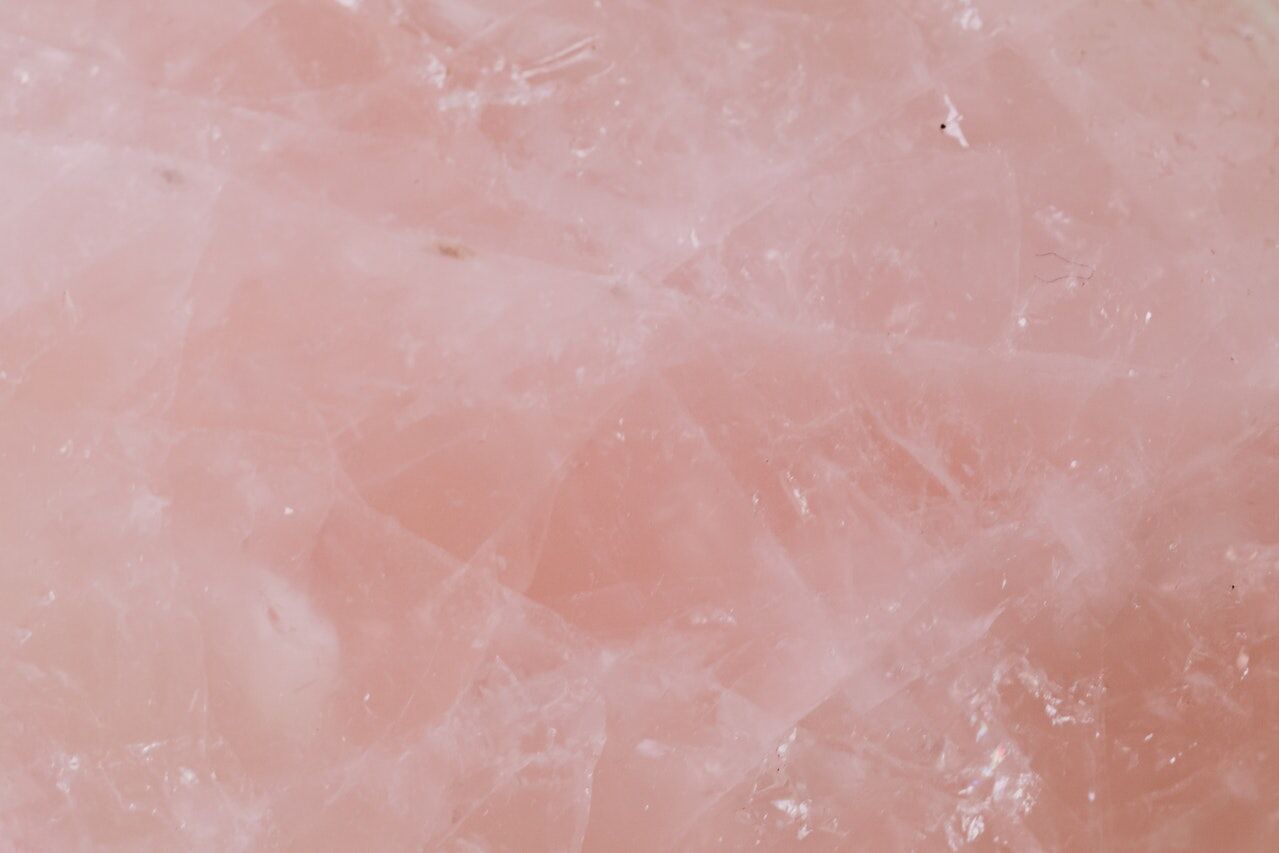 Close-up view of pink quartz surface with natural texture and patterns